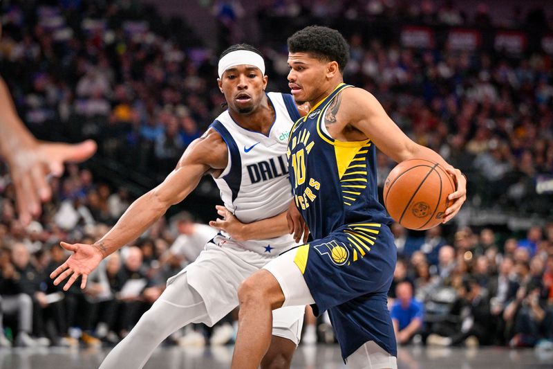 Oct 29, 2025; Dallas, Texas, USA; Indiana Pacers guard RayJ Dennis (10) moves the ball past Dallas Mavericks guard Brandon Williams (10) during the second quarter at the American Airlines Center. Mandatory Credit: Jerome Miron-Imagn Images