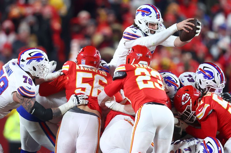 Jan 26, 2025; Kansas City, MO, USA; Buffalo Bills quarterback Josh Allen (17) dives for a first down against the Kansas City Chiefs during the second half in the AFC Championship game at GEHA Field at Arrowhead Stadium.