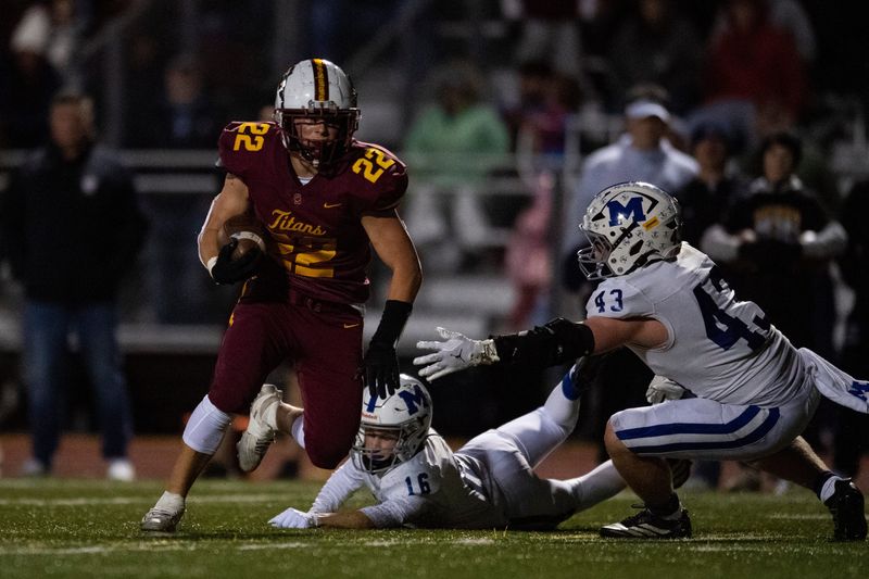 Gibson Southern's Colin Scherer (22) carries the ball as the Gibson Southern Titans play the Memorial Tigers during the IHSAA sectional semifinals in Fort Branch, Ind., Friday, Oct. 31, 2025.