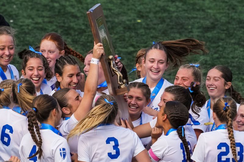 The Mishawaka Marian Knights celebrate winning Saturday, Nov. 1, 2025, after the Class 2A girls soccer state championship at the Carroll Stadium at IU Indianapolis. The Mishawaka Marian Knights defeated the Park Tudor Panthers, 3-0.
