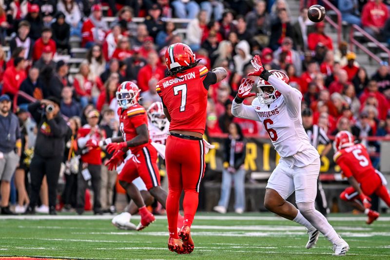 Nov 1, 2025; College Park, Maryland, USA; Maryland Terrapins quarterback Malik Washington (7) throws as Indiana Hoosiers defensive lineman Mikail Kamara (6) applies pressure during the second quarter at SECU Stadium. Mandatory Credit: Tommy Gilligan-Imagn Images