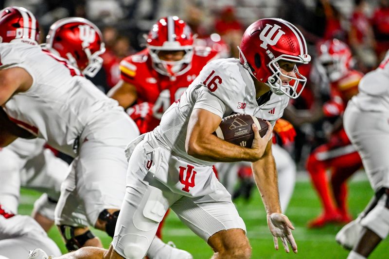 Nov 1, 2025; College Park, Maryland, USA; Indiana Hoosiers quarterback Alberto Mendoza (16) rushes during the second half against the Maryland Terrapins at SECU Stadium. Mandatory Credit: Tommy Gilligan-Imagn Images
