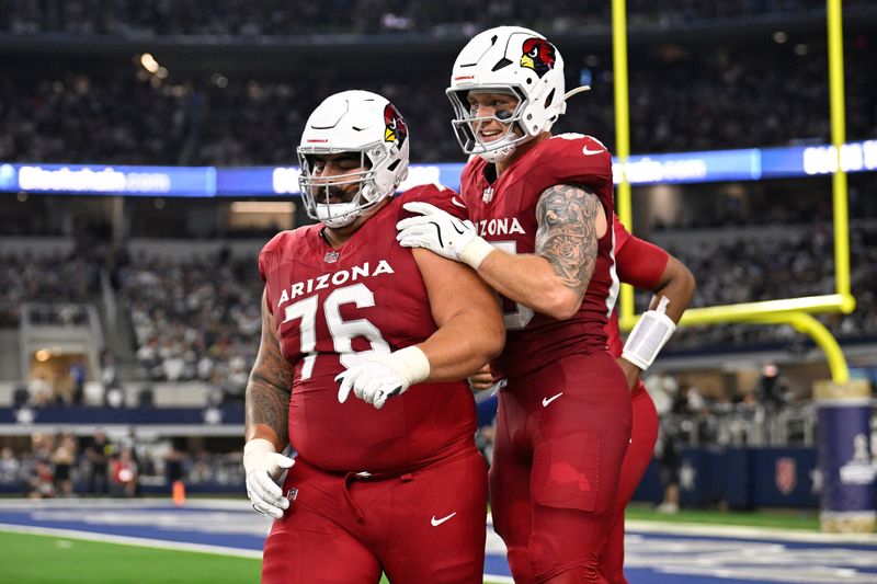 Nov 3, 2025; Arlington, Texas, USA; Arizona Cardinals tight end Trey McBride (85) celebrates with guard Will Hernandez (76) after scoring a touchdown against the Dallas Cowboys in the second half at AT&T Stadium. Mandatory Credit: Jerome Miron-Imagn Images