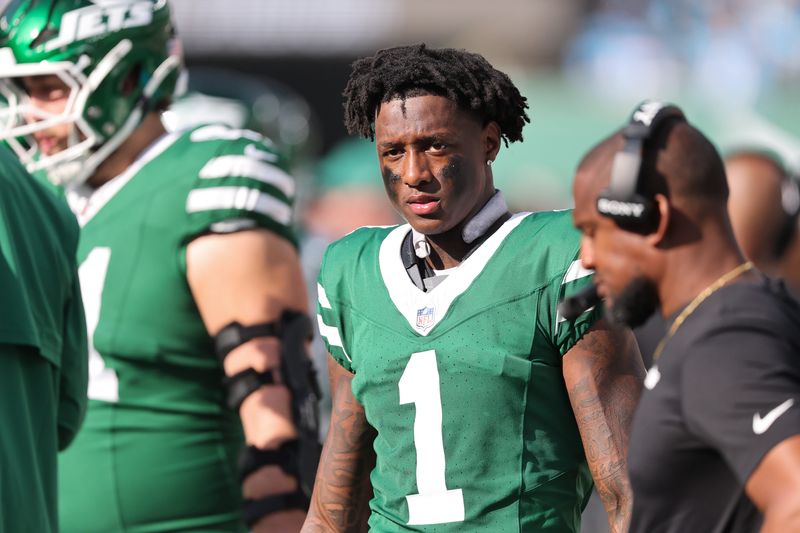 New York Jets cornerback Sauce Gardner (1) looks on from the sidelines during the third quarter against the Carolina Panthers at MetLife Stadium.