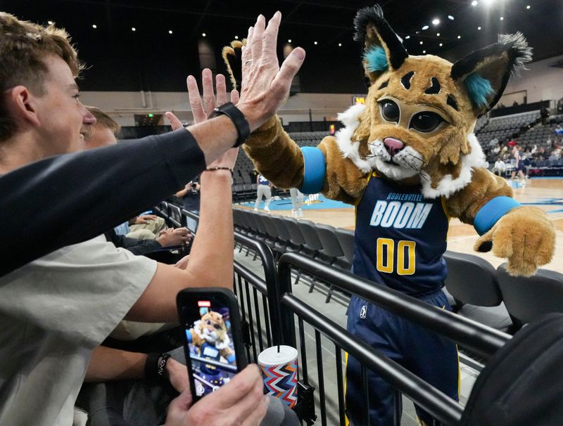 Bobby, the Noblesville Boom’s mascot, greets fans before a Noblesville Boom scrimmage Tuesday, Nov. 4, 2025, at The Arena at Innovation Mile in Noblesville. The Noblesville Boom, the Indiana Pacers' G League affiliate, was previously the Indiana Mad Ants.