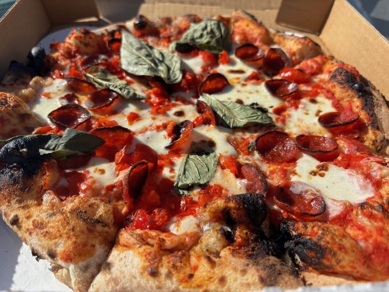 The diavola pizza with tomato sauce, pepperoni, mozzarella cheese, basil and peppadew, is among the Neapolitan-style pies at Diavola at 1134 E. 54th St. Nov. 4, 2025.