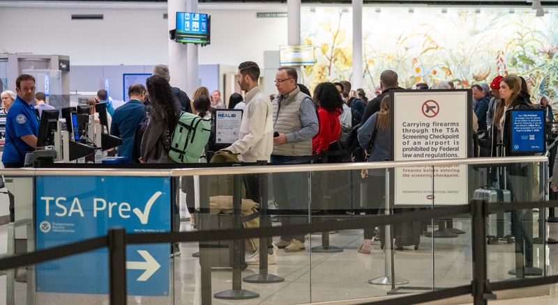 Travelers wait in the TSA line Friday, Nov. 7, 2025, at Indianapolis International Airport.