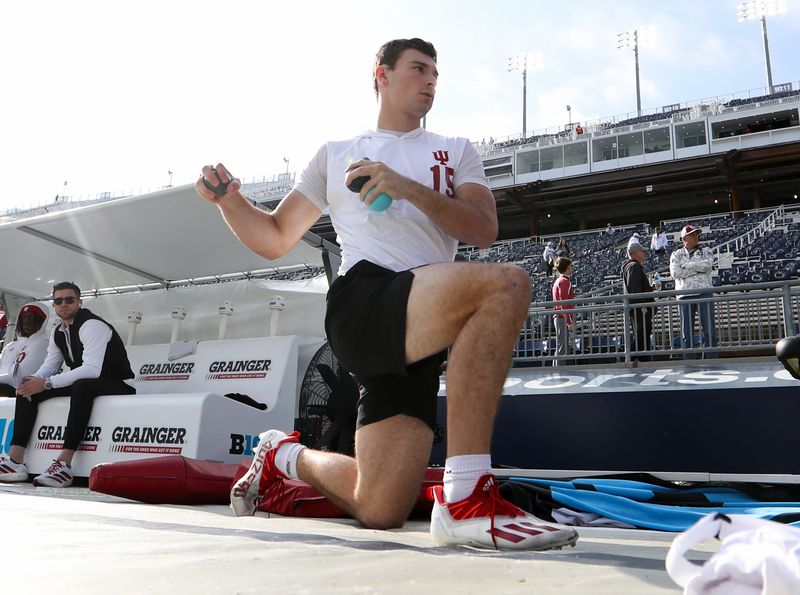Nov 8, 2025; University Park, Pennsylvania, USA; Indiana Hoosiers quarterback Fernando Mendoza (15) warms up prior to the game against the Penn State Nittany Lions at Beaver Stadium. Mandatory Credit: Matthew O'Haren-Imagn Images