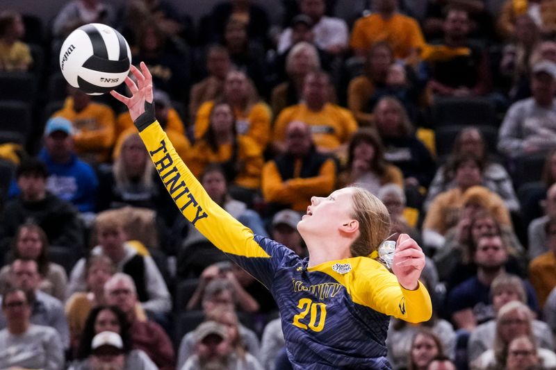 Trinity Lutheran Cougars middle blocker Rachel Bonde (20) tips the ball over Saturday, Nov. 8, 2025, during the class 1A girls volleyball state championship game between Faith Christian and Trinity Lutheran at Gainbridge Fieldhouse in Indianapolis.
