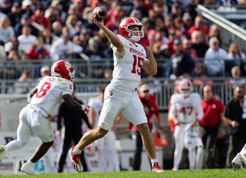 Nov 8, 2025; University Park, Pennsylvania, USA; Indiana Hoosiers quarterback Fernando Mendoza (15) throws a pass during the first quarter against the Penn State Nittany Lions at Beaver Stadium. Mandatory Credit: Matthew O'Haren-Imagn Images