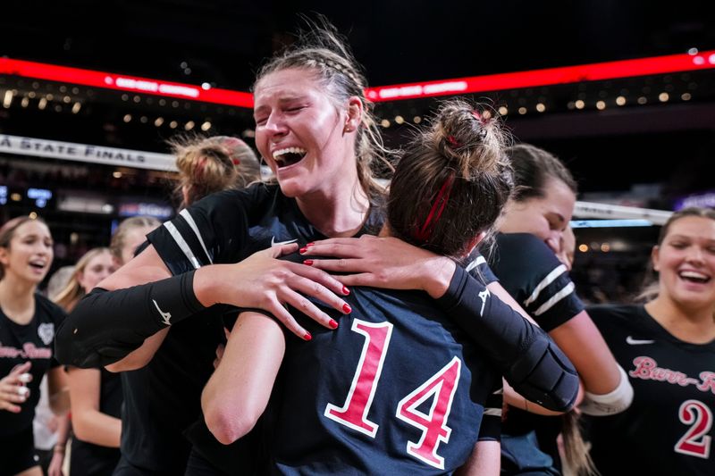 Barr-Reeve Addison Jones (30) hugs Barr-Reeve Lanie Graber (14) on Saturday, Nov. 8, 2025, after winning the Class 2A girls volleyball state championship game between Benton Central and Barr-Reeve at Gainbridge Fieldhouse in Indianapolis. Barr-Reeve defeated Benton Central in five sets.