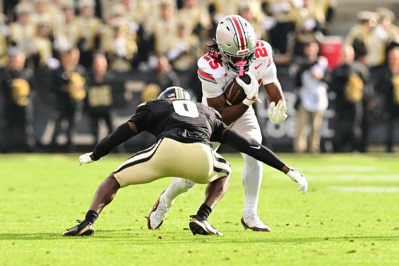 Nov 8, 2025; West Lafayette, Indiana, USA; Ohio State Buckeyes running back Bo Jackson (25) rushes as Purdue Boilermakers defensive back Tony Grimes (0) defends during the third quarter at Ross-Ade Stadium. Mandatory Credit: Marc Lebryk-Imagn Images