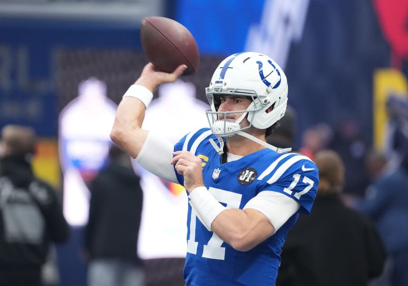 Indianapolis Colts quarterback Daniel Jones (17) warms up before playing against the Atlanta Falcons during the NFL Berlin Game at Olympic Stadium.