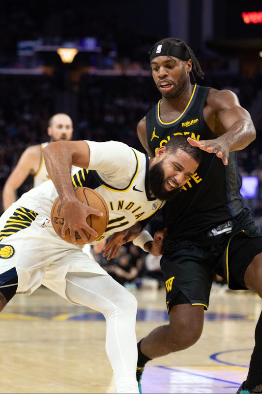 Nov 9, 2025; San Francisco, California, USA; Indiana Pacers forward Cody Martin (11) drives against Golden State Warriors guard Buddy Hield (7) during the fourth quarter at Chase Center. Mandatory Credit: D. Ross Cameron-Imagn Images