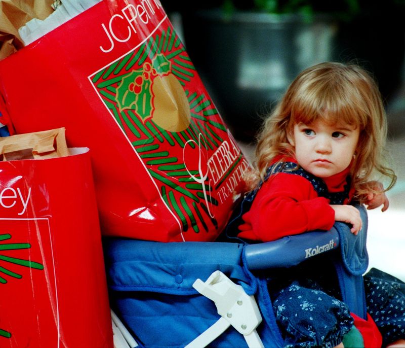 Staff photo by Don Burk...Nov. 24, 1995
Ashley Glaze, 27 months old gets urrounded by Xmas packages during the day after Thanksgiving shopping at Regency Square Mall.