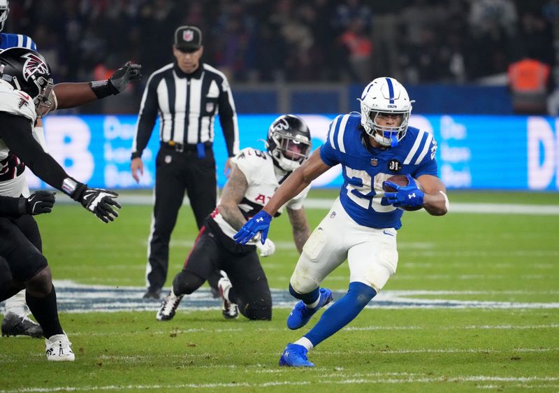 Indianapolis Colts running back Jonathan Taylor (28) runs the ball against the Atlanta Falcons during the NFL Berlin Game at Olympic Stadium.