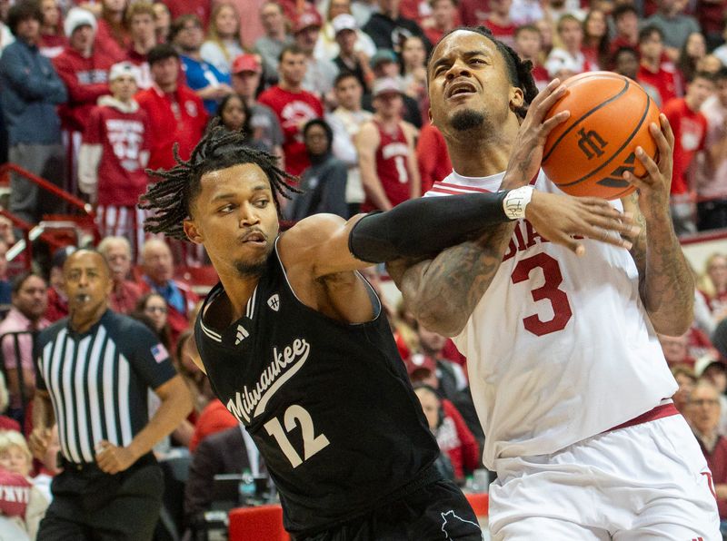 Indiana's Lamar Wilkerson (3) is fouled by Milwaukee's Seth Hubbard (12) during the Indiana versus Milwaukee mens basketball game at Simon Skjodt Assembly Hall on Wednesday, Nov. 12, 2025.