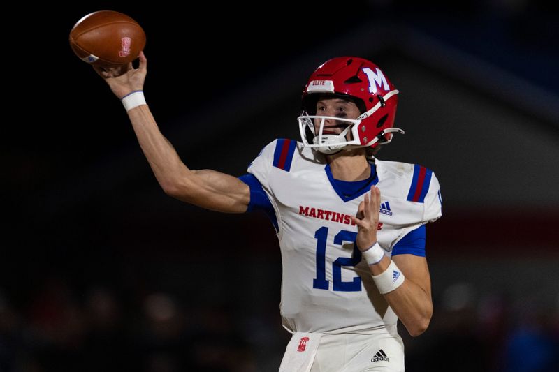 Martinsville's Chase Davis (12) passes as the Heritage Hills Patriots play the Martinsville Artesians in the 2025 IHSAA Class 4A Regional football game in Lincoln City, Ind., Friday, Nov. 14, 2025.