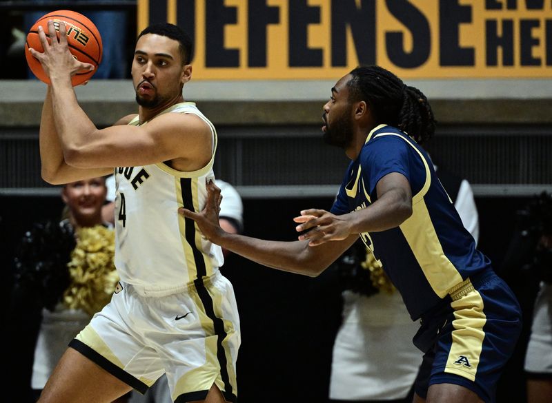 Nov 16, 2025; West Lafayette, Indiana, USA; Purdue Boilermakers forward Trey Kaufman-Renn (4) looks for an open teammate during the first half against the Akron Zips at Mackey Arena. Mandatory Credit: Marc Lebryk-Imagn Images