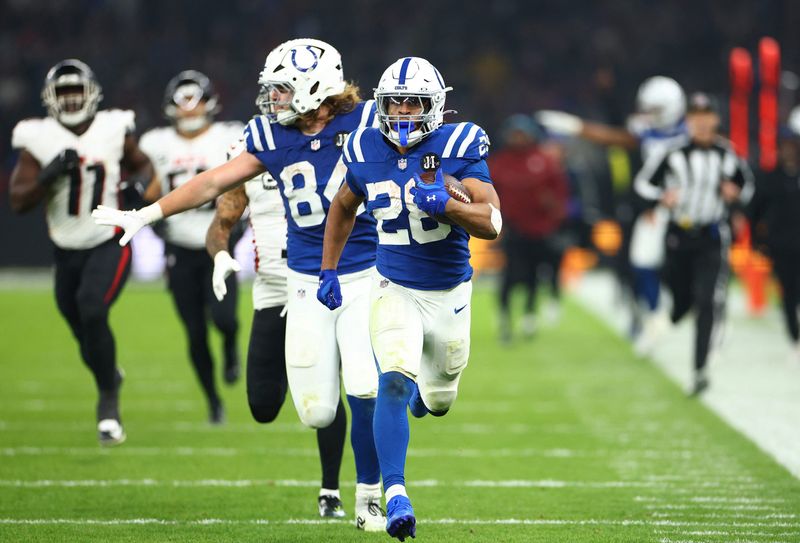 [US, Mexico & Canada customers only] Nov 9, 2025; Berlin, GERMANY; Indianapolis Colts running back Jonathan Taylor (28) scores a touchdown against the Atlanta Falcons during the Berlin Game at Olympic Stadium. Mandatory Credit: Lisi Niesner/Reuters via Imagn Images