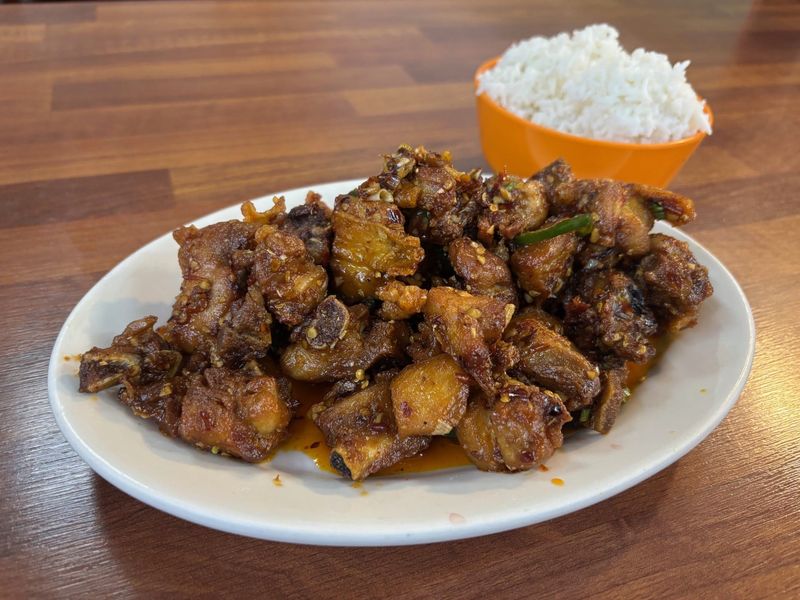 Spicy chicken Geleshan-style, aka firecracker chicken, Chongqing chicken, mala chicken or laziji, is a lip-tingling dish you can find at Asian Snack in the Saraga International Grocery at 3605 Commercial Drive. Nov. 19, 2025.