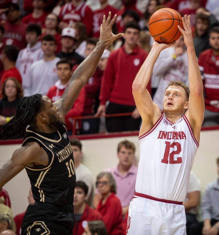 Indiana's Tucker DeVries (12) shoots during the Indiana versus Lindenwood men's basketball game at Simon Skjodt Assembly Hall on Thursday, Nov. 20, 2025.