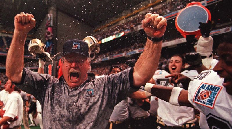 Purdue coach Joe Tiller reacts to being dunked with water and winning the 1998 Alamo Bowl against fourth-ranked Kansas State.