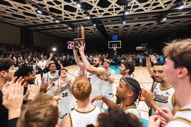 Purdue center Oscar Cluff hoists the Baha Mar Championship trophy after the title win over Texas Tech on Friday, Nov. 21, 2025, in Nassau, Bahamas.