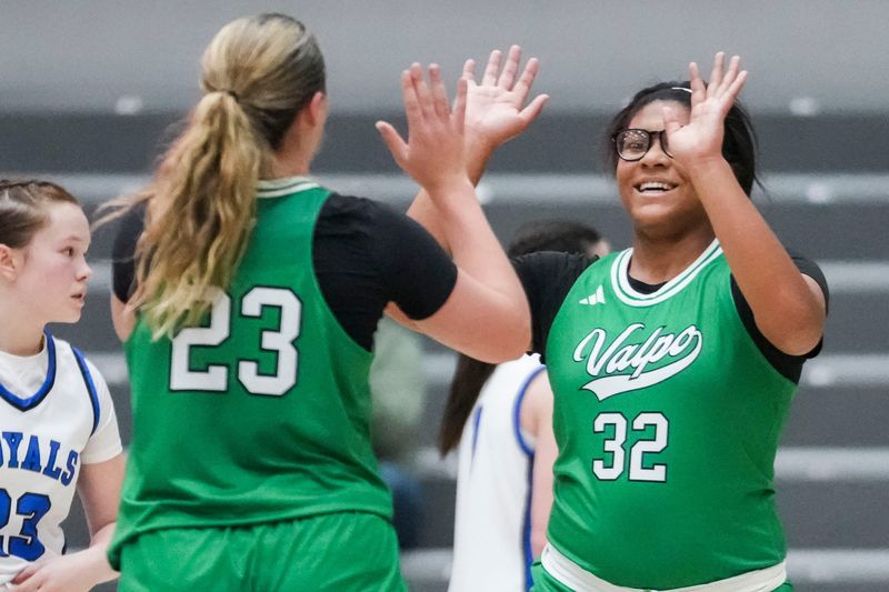 Valparaiso guard Lilli Barnes (23) and Valparaiso Delilah Kincaid (32) celebrate Saturday, Nov. 22, 2025, after the first half of a 2025 Sneakers for Santa game between Valparaiso and the Eastern Hancock Royals at Brownsburg High School.