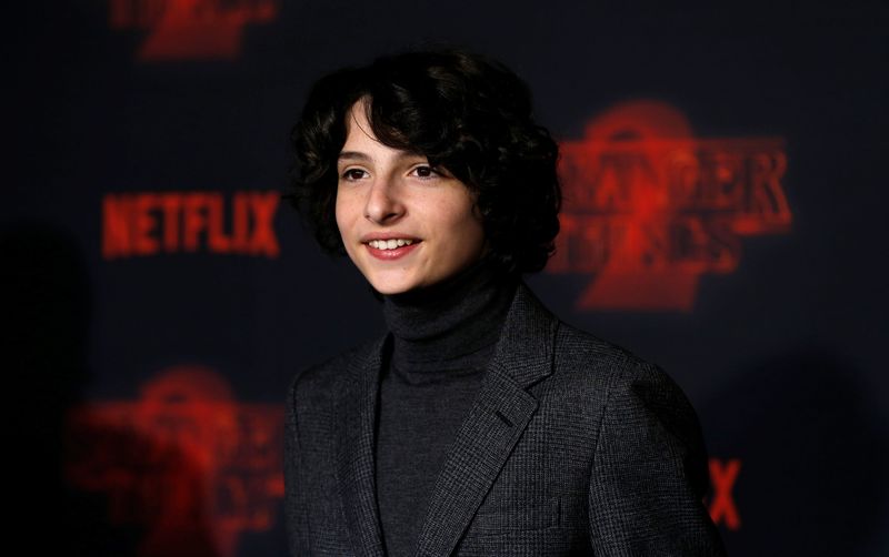 Cast member Finn Wolfhard poses at the premiere for the second season of the television series "Stranger Things" in Los Angeles, California, U.S., October 26, 2017. REUTERS/Mario Anzuoni