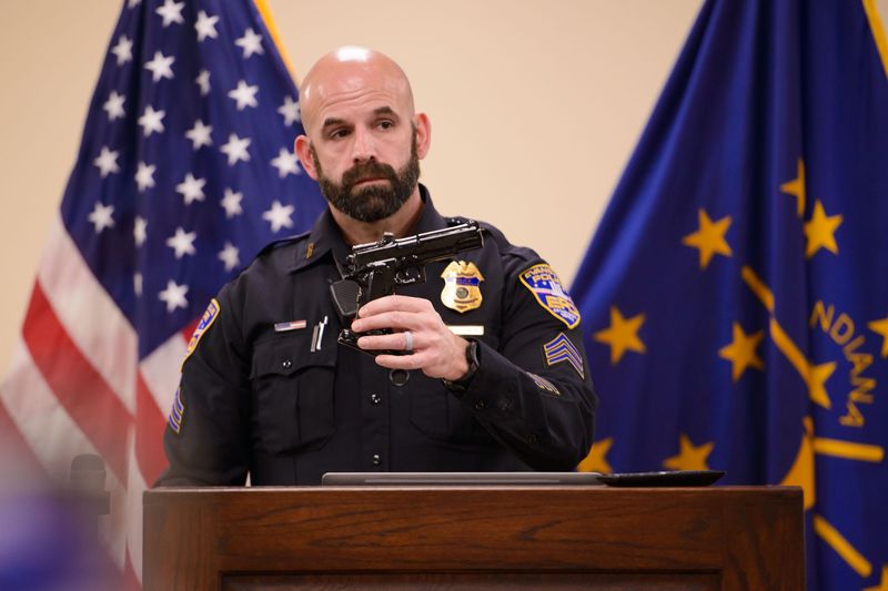 Evansville Police Department spokesman Sgt. Anthony Aussieker holds the replica handgun, what he described as a smoking pipe, that 58-year-old Everett Nunn reportedly held before a city police officer shot and killed him Saturday, Nov. 22, 2025.