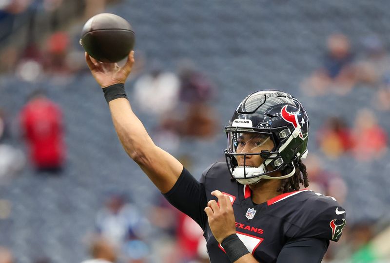 Oct 27, 2024; Houston, Texas, USA; Houston Texans quarterback C.J. Stroud (7) warms up before playing against the Indianapolis Colts at NRG Stadium. Mandatory Credit: Thomas Shea-Imagn Images