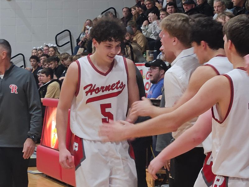 Rossville junior Brayden Thiele-Hahn greeted by teammates after scoring a school record 52 points against Delphi on Wednesday, Nov. 26, 2025.