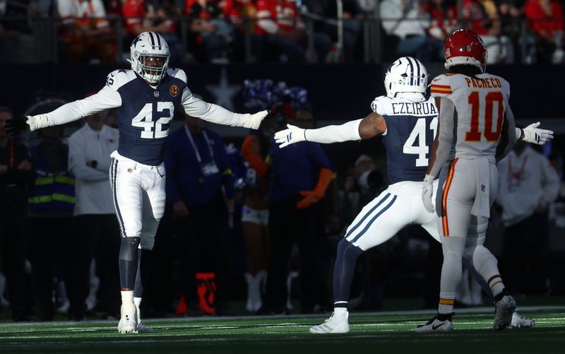 Nov 27, 2025; Arlington, Texas, USA; Dallas Cowboys defensive end Jadeveon Clowney (42) and Dallas Cowboys defensive end Donovan Ezeiruaku (41) celebrate after a play against the Kansas City Chiefs during the second quarter at AT&T Stadium. Mandatory Credit: Kevin Jairaj-Imagn Images