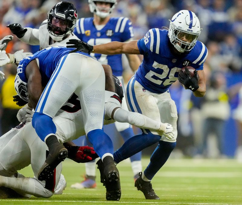 Indianapolis Colts running back Jonathan Taylor (28) rushes the ball Sunday, Nov. 30, 2025, during a game against the Houston Texans at Lucas Oil Stadium in Indianapolis.
