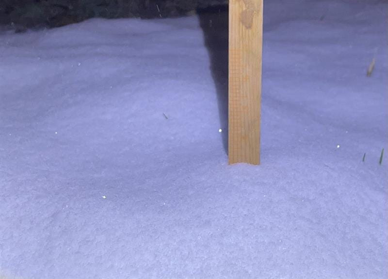 A Home Depot paint stick provides a highly unscientific snow measurement of 3 inches in the Wanamaker neighborhood in Indianapolis about 7 p.m. Dec. 1, 2025.