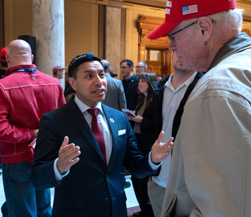 Indiana Secretary of State Diego Morales talks to people before the All In For Indiana gathering, a pro-redistricting rally, Friday, Dec. 5, 2025 at the Indiana Statehouse.