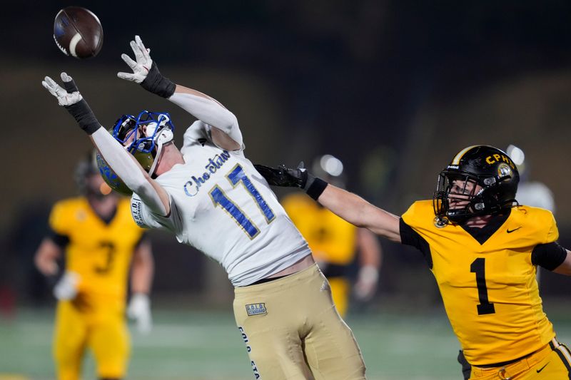 Choctaw's Titus Hawk catches a pass for a touchdown beside Alex Dudley of Sand Springs during the Class 6A-II high school football championship game between Choctaw and Sand Springs at Chad Richison Stadium in Edmond, Okla., Friday, Dec. 5, 2025.