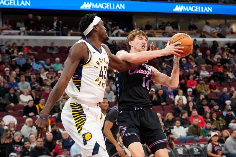 Dec 5, 2025; Chicago, Illinois, USA; Chicago Bulls forward Matas Buzelis (14) grabs a rebound over Indiana Pacers forward Pascal Siakam (43) during the first half at United Center. Mandatory Credit: David Banks-Imagn Images
