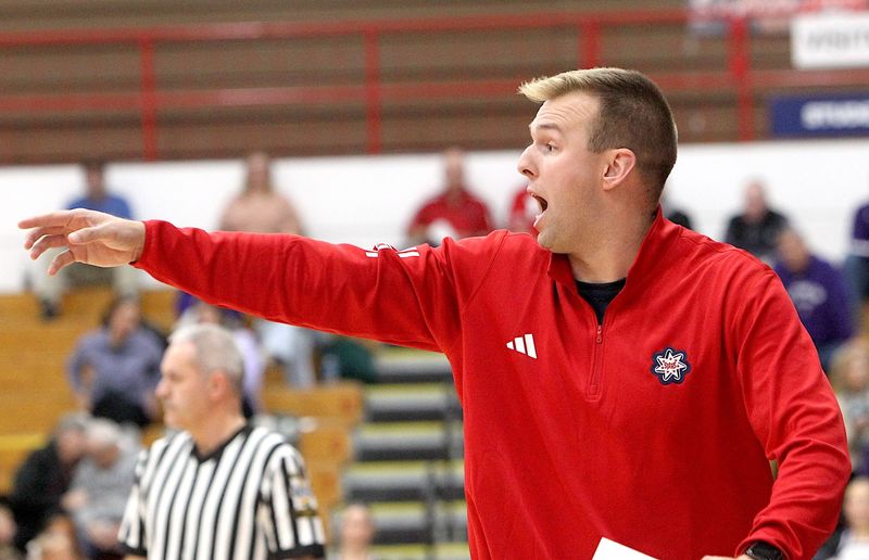 First-year Bedford North Lawrence boys basketball coach Jackson Ryan instructs his team from the sidelines as the Stars take on Bloomington South in the BNL Fieldhouse on Friday, Dec. 5, 2025.