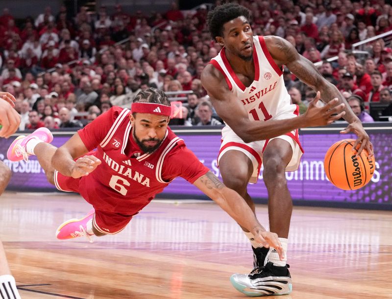 Louisville Cardinals guard Kobe Rodgers (11) gains control of the ball from Indiana Hoosiers guard Tayton Conerway (6) during a game Saturday, Dec. 6, 2025, at Gainbridge Fieldhouse in Indianapolis.