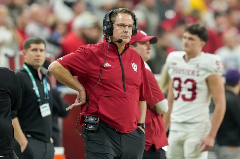 Indiana Hoosiers head coach Curt Cignetti watches the action on the field Saturday, Dec. 6, 2025, during the Big Ten football championship against the Ohio State Buckeyes at Lucas Oil Stadium in Indianapolis.