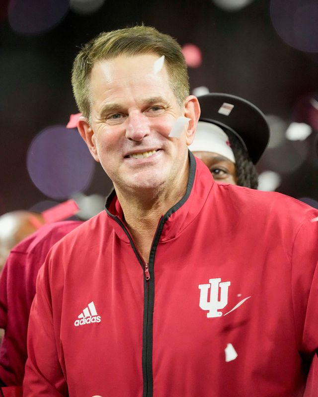 Indiana Hoosiers head coach Curt Cignetti celebrates with his team Sunday, Dec. 7, 2025, after winning the Big Ten football championship against the Ohio State Buckeyes at Lucas Oil Stadium in Indianapolis.