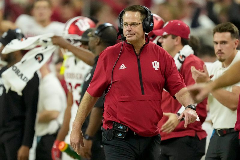 Indiana Hoosiers head coach Curt Cignetti walks the sideline Sunday, Dec. 7, 2025, during the Big Ten football championship against the Ohio State Buckeyes at Lucas Oil Stadium in Indianapolis.
