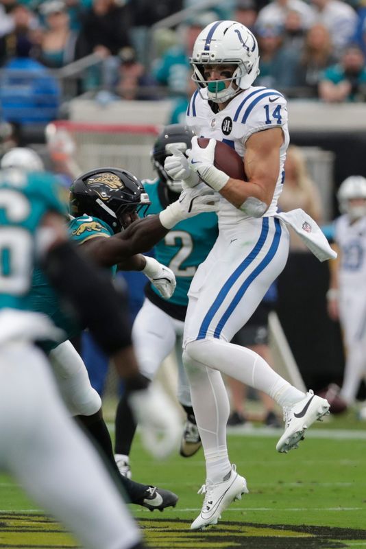 Dec 7, 2025; Jacksonville, Florida, USA; Indianapolis Colts wide receiver Alec Pierce (14) makes a catch against the Jacksonville Jaguars during the first half at EverBank Stadium. Mandatory Credit: Travis Register-Imagn Images
