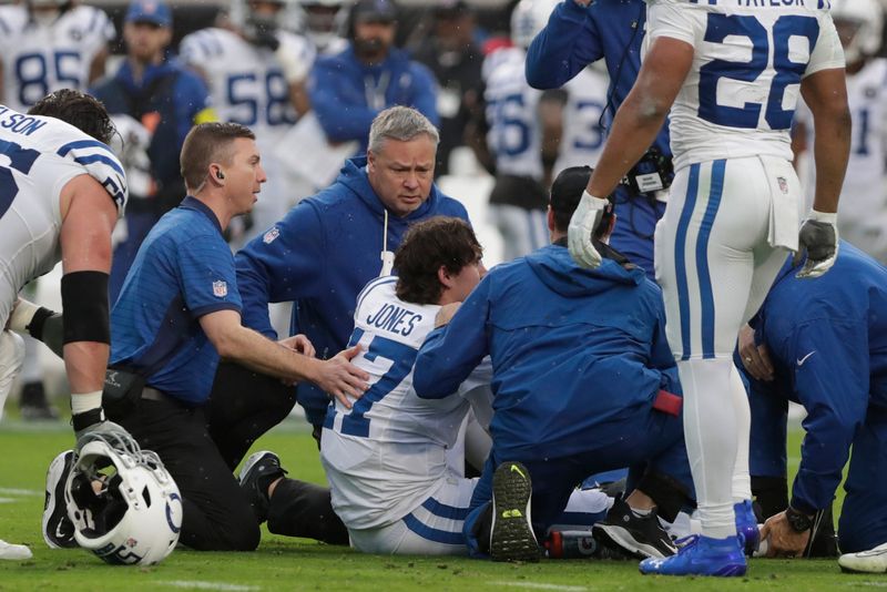 Dec 7, 2025; Jacksonville, Florida, USA; Indianapolis Colts quarterback Daniel Jones (17) is tended to by trainers after going down with an apparent injury against the Jacksonville Jaguars during the first half at EverBank Stadium. Mandatory Credit: Travis Register-Imagn Images