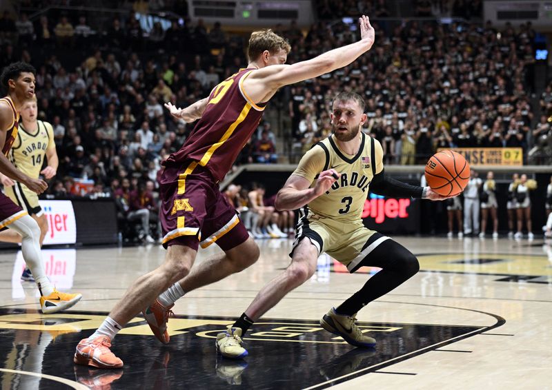 Purdue guard Braden Smith jukes Minnesota forward Cade Tyson on Wednesday, Dec. 10, 2025, at Mackey Arena.