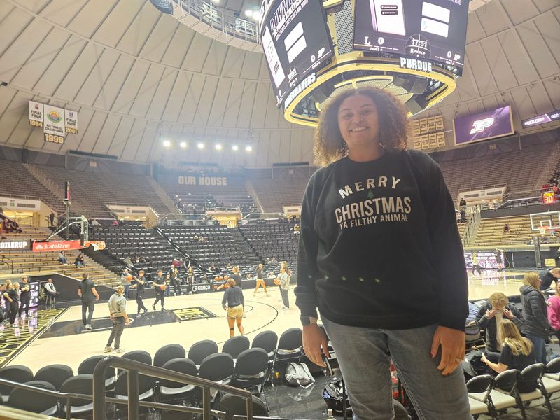 Attica Elementary School sixth grade math teacher and former Phoenix Mercury player Macee Overman takes in the action during a youth day for Purdue women's basketball against Lipscomb at Mackey Arena in West Lafayette, Ind. on Dec. 11, 2025.