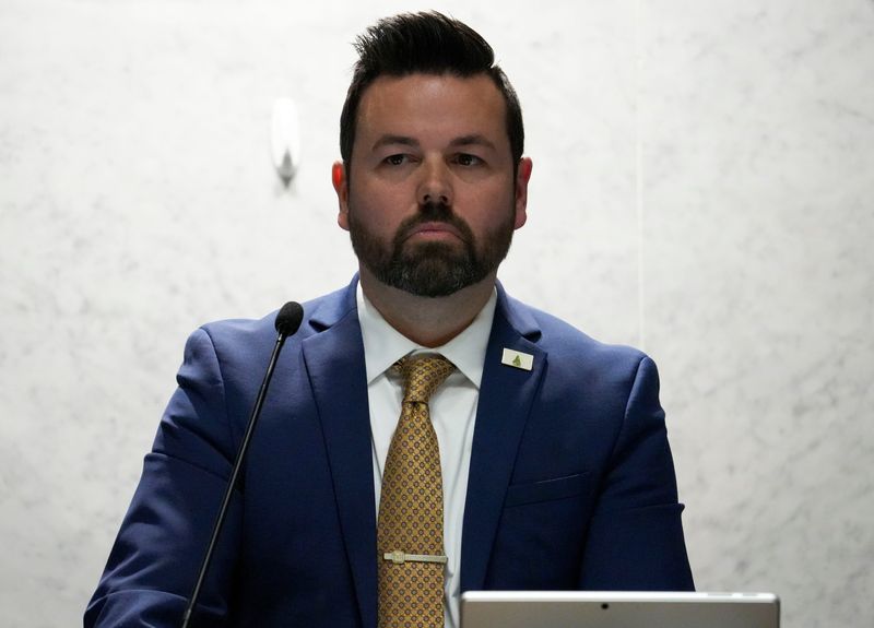 Lt. Gov. Micah Beckwith looks out as the Senate gathers during mid-cycle session to vote on redistricting Thursday, Dec. 11, 2025, in the Senate Chambers of the Indiana Statehouse in Indianapolis. The Indiana Senate rejected the redistricting bill with a 19-31 vote.
