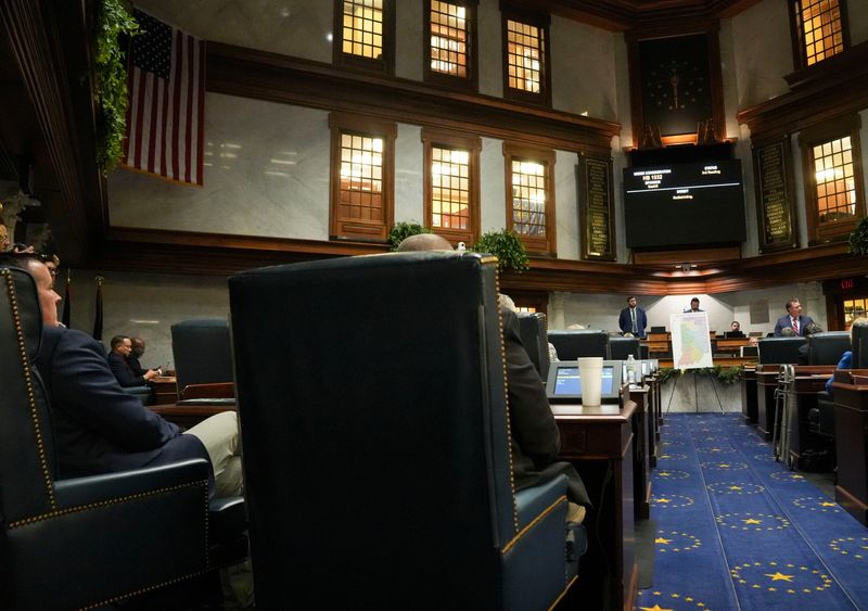 The Indiana Senate gathers during mid-cycle session to vote on redistricting Thursday, Dec. 11, 2025, in the Senate Chambers of the Indiana Statehouse in Indianapolis. The Indiana Senate rejected the redistricting bill with a 19-31 vote.